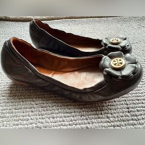 Tory Burch Black Leather Flower Logo Flats with Gold Medallion